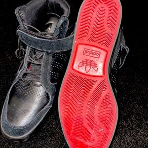 Adidas black Hi-Top with red bottoms size 11